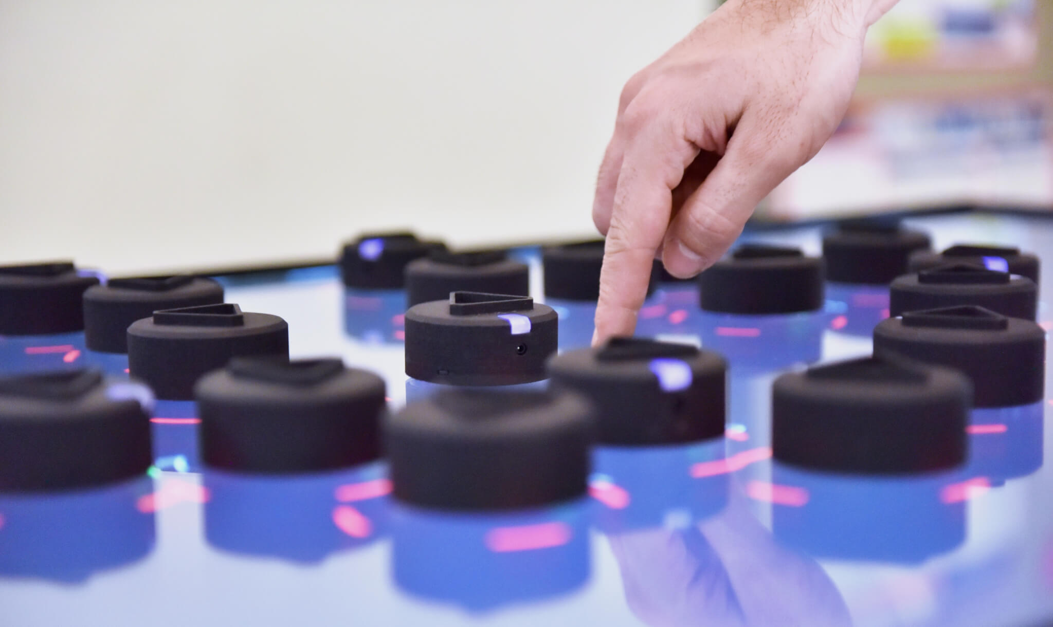 Swarm, tiny interactive robots that serve as tangible interfaces for a computer.