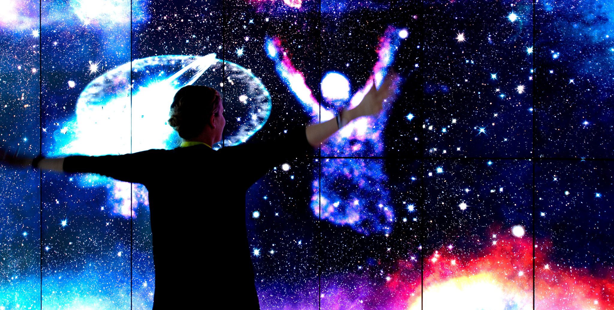A woman engages RealSense, an immersive experiential trade show exhibit.