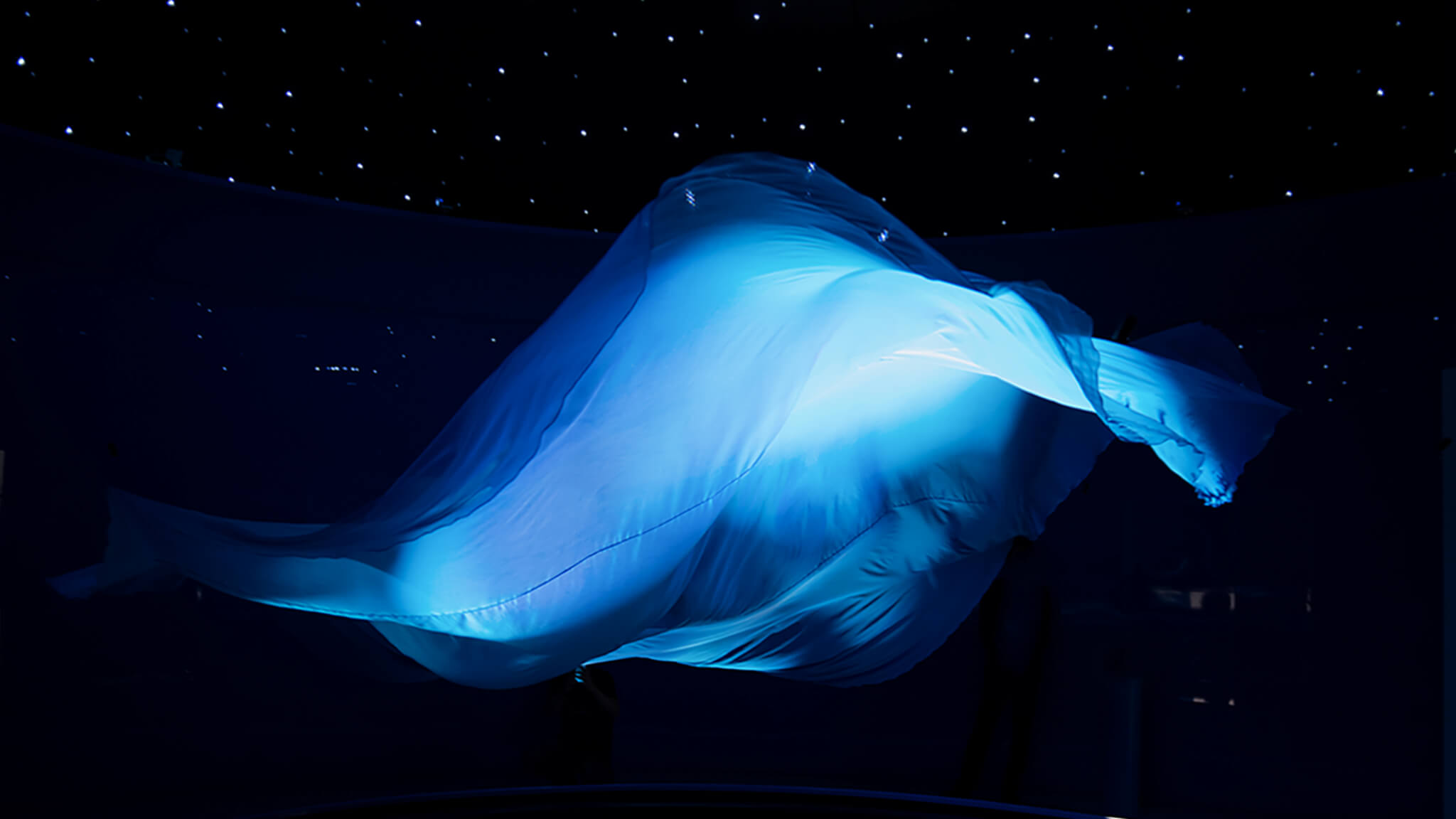 One art installation in an immersive experiential brand event in Shanghai. A silk wave dances in the air.
