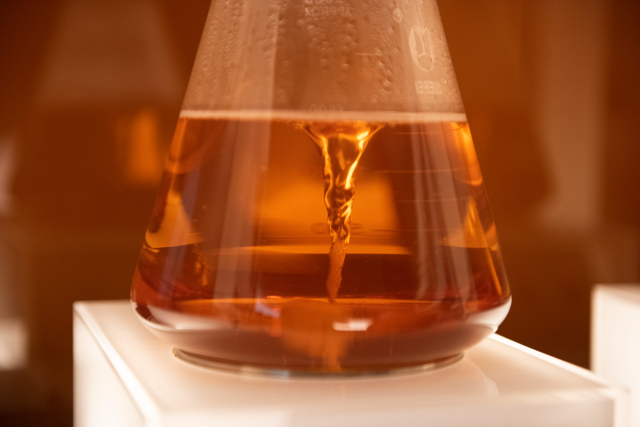One art installation in an immersive experiential brand event in Shanghai. A kinetic potion spins in a glass.