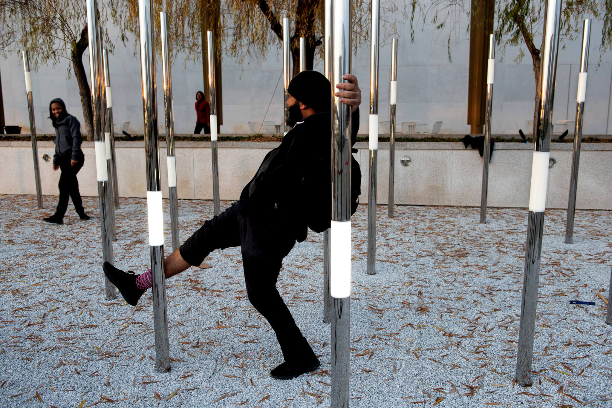 Ekene interacts with Heartfelt, an interactive permanent outdoor sculpture.