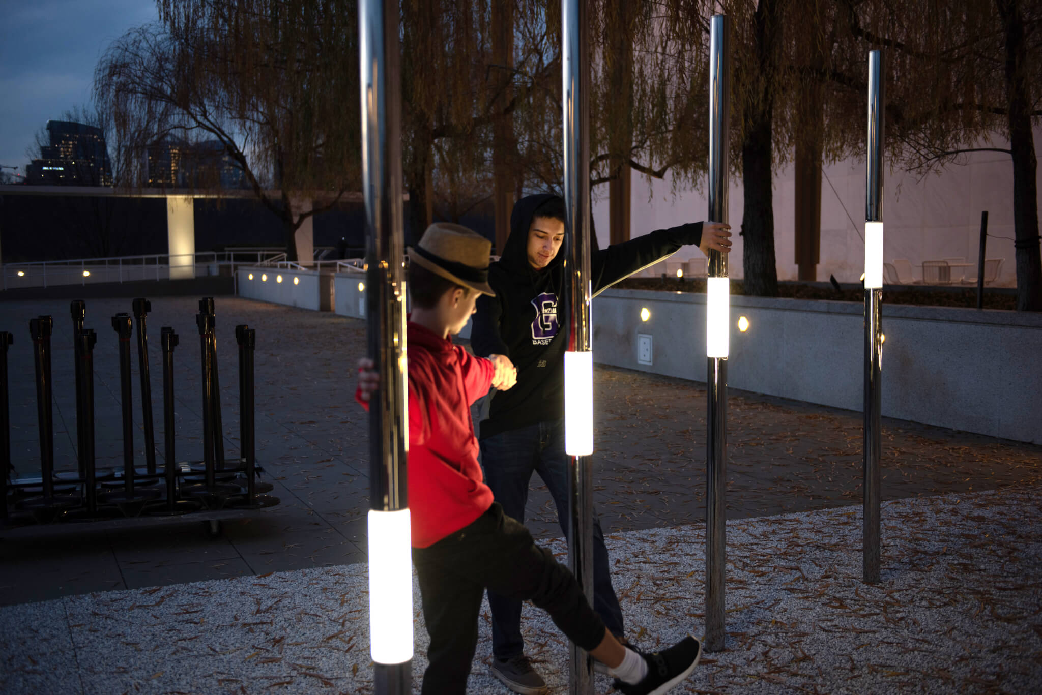 Two boys interact with Heartfelt, an interactive permanent outdoor sculpture.