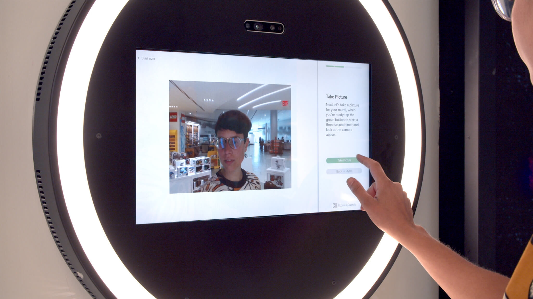 Interactive digital media wall retail installation at LaGuardia Airport.